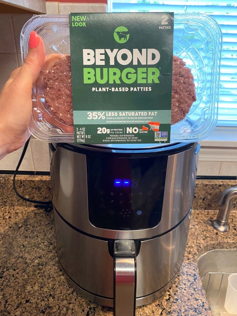 package of Beyond Burgers in front of air fryer