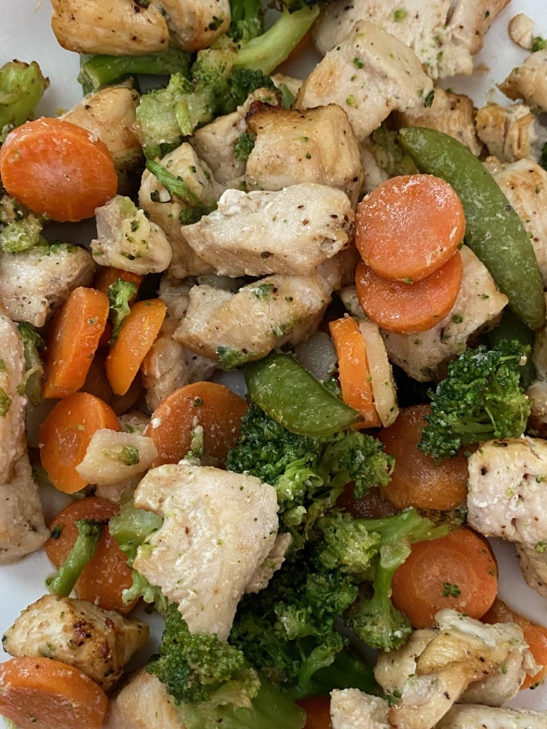 close-up of seasoned Air Fryer Chicken And Frozen Vegetables