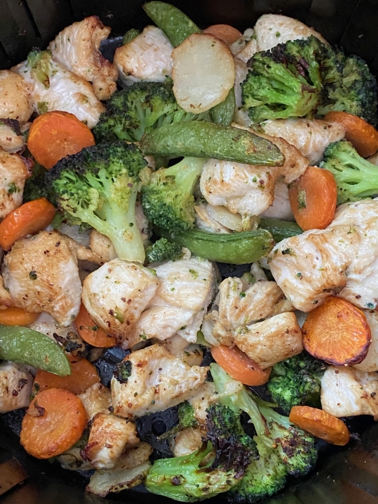 close-up of chicken and veggies in sauce