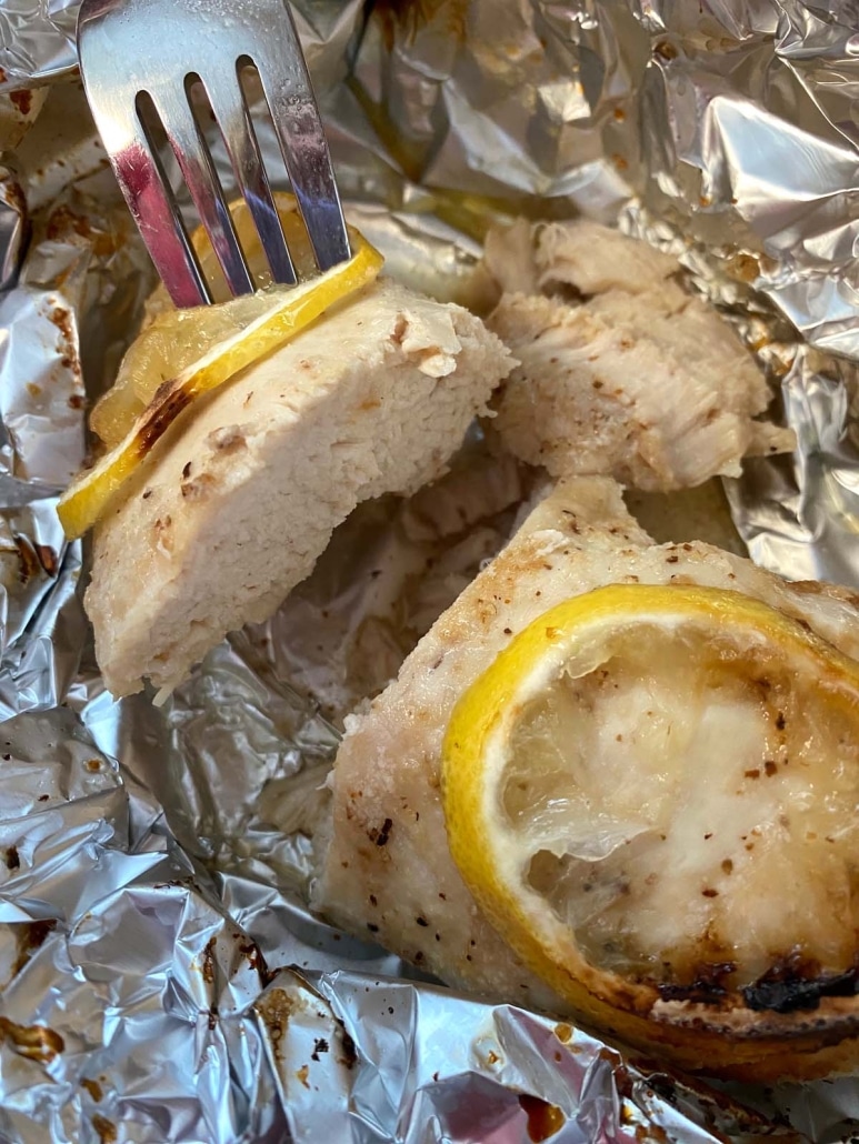 fork holding piece of Air Fryer Chicken Breast In Foil