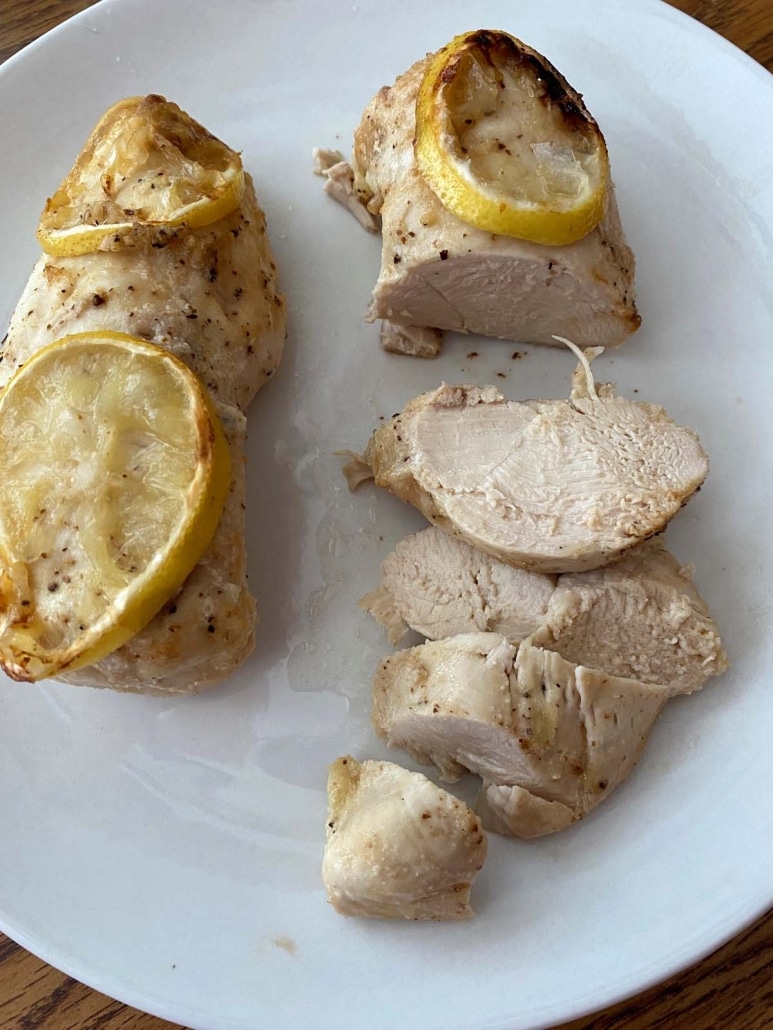 Air Fryer Chicken Breast on a plate with lemon