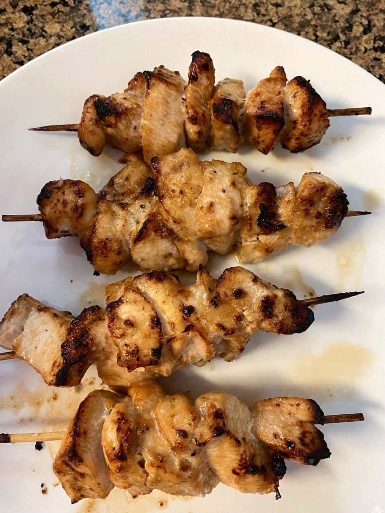 seasoned chicken kabobs on a plate