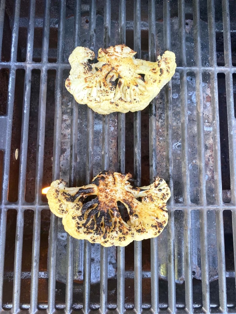 cauliflower steaks cooking on the grill