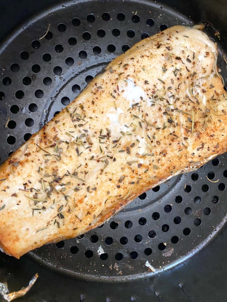 seasoned rainbow trout inside air fryer