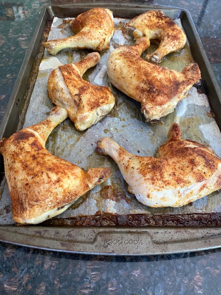 6 pieces Baked Chicken Leg Quarters on a tray