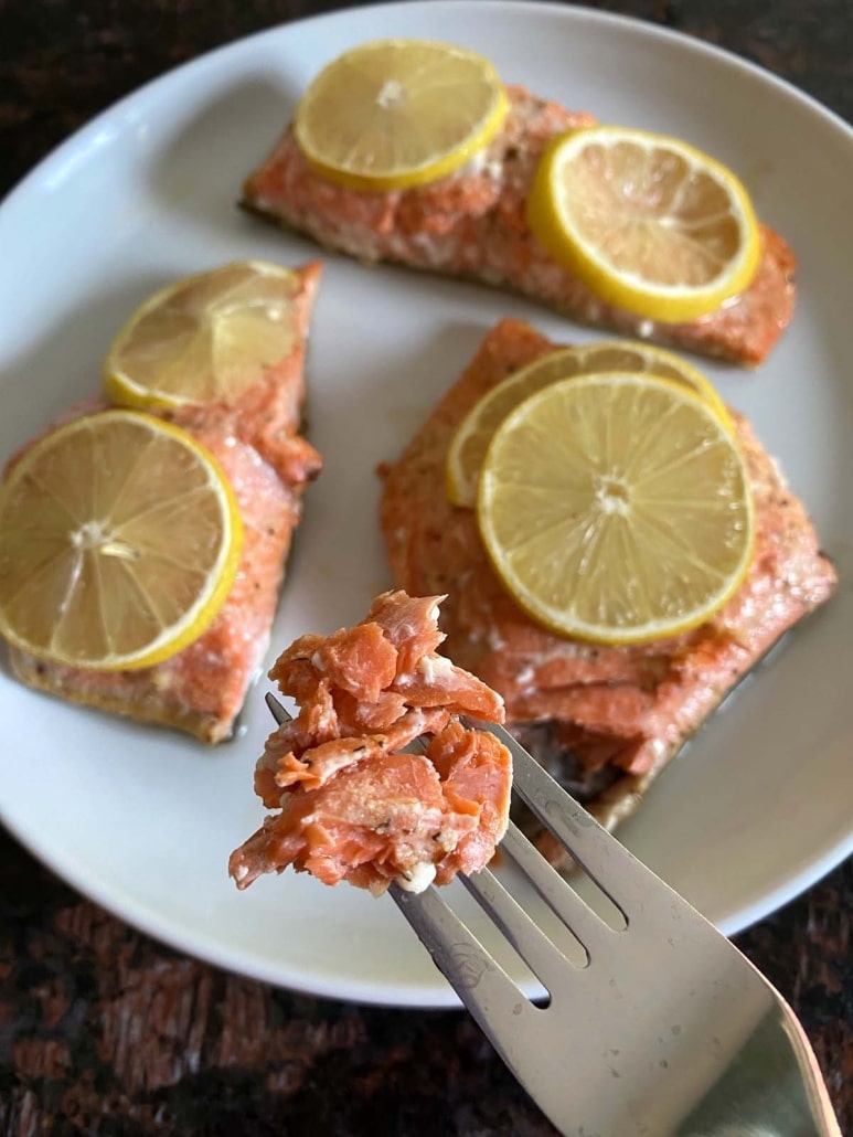 fork holding piece of Baked Sockeye Salmon