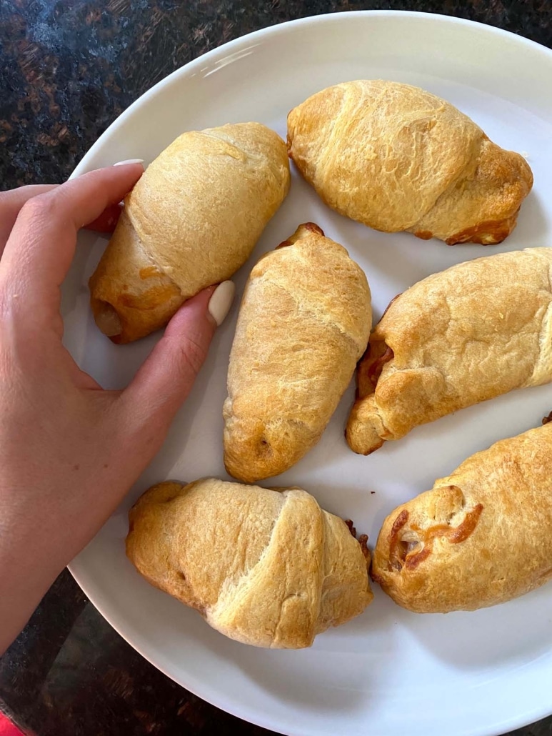 hand holding Pizza Crescent Roll