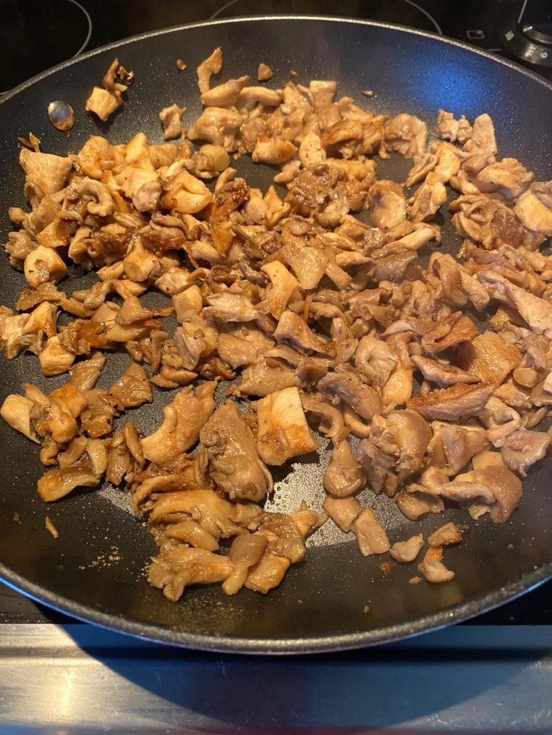 oyster mushrooms sautéing in a pan