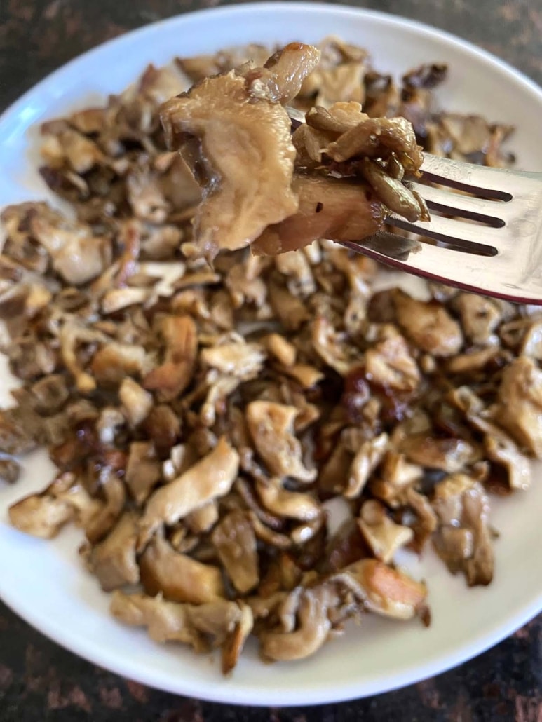 fork holding piece of Pan Fried Oyster Mushrooms