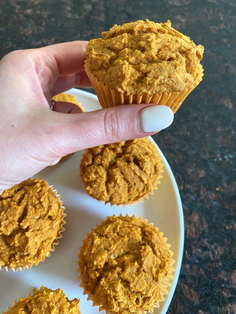 hand holding perfectly tender pumpkin muffin