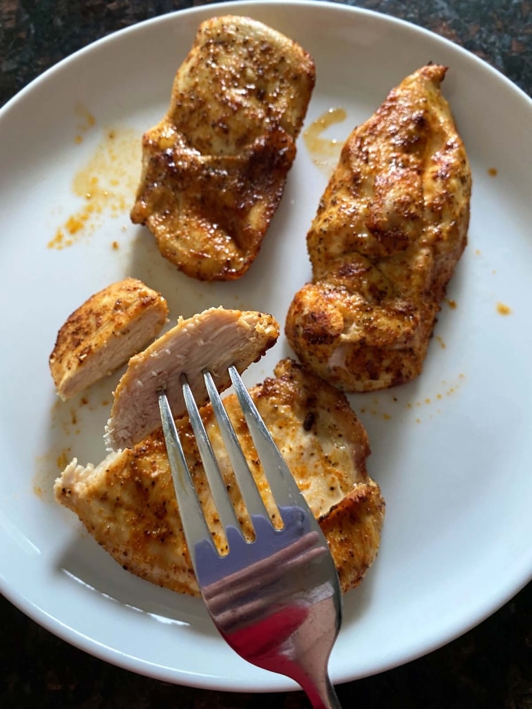 fork with bite of Air Fryer Thin Sliced Chicken Breast