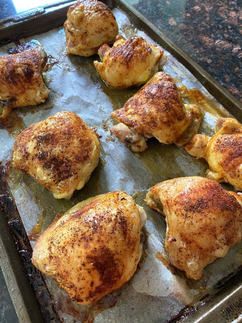 Baked Bone-In Chicken Thighs on a baking sheet