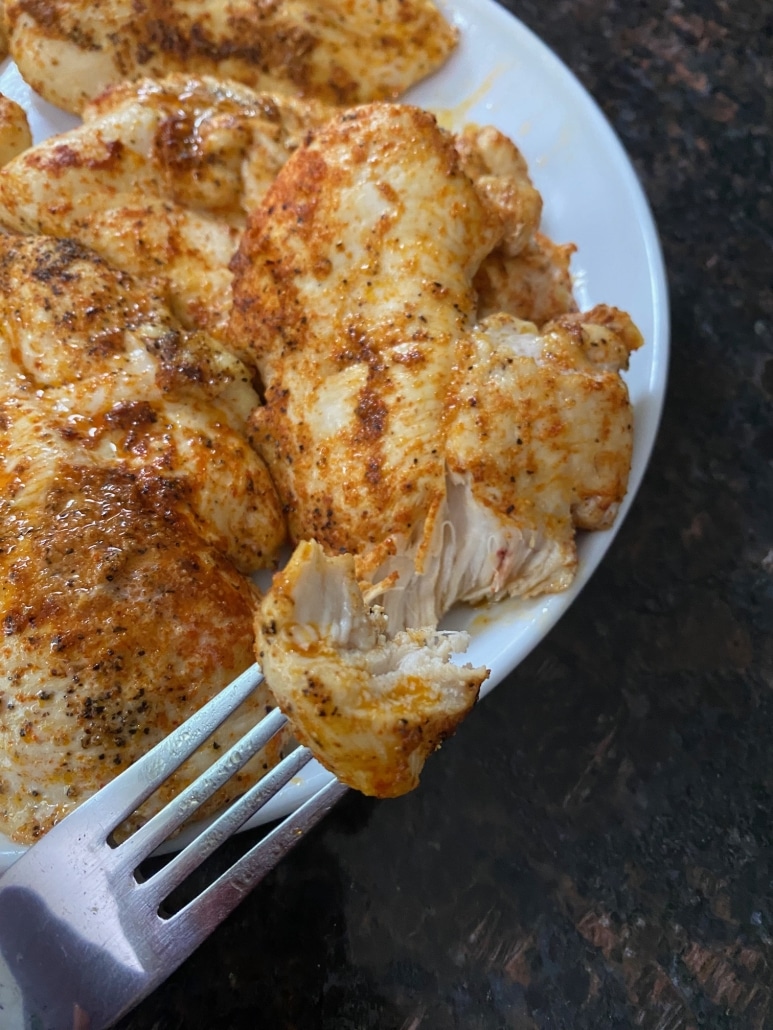 fork holding piece of Baked Chicken Breast