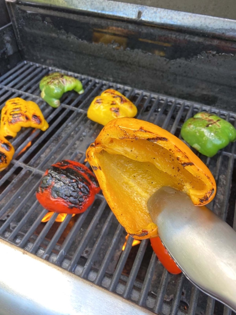 tong flipping over slice of bell pepper