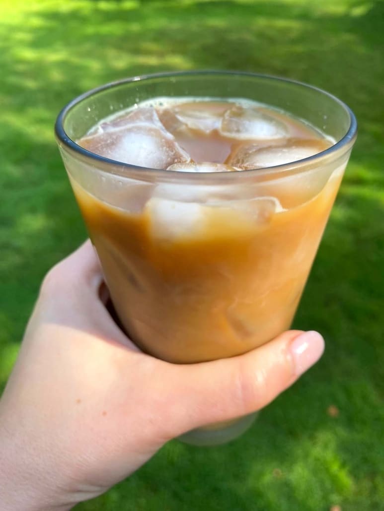 hand holding Instant Coffee Iced Coffee