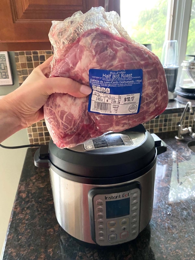 pork shoulder in front of instant pot