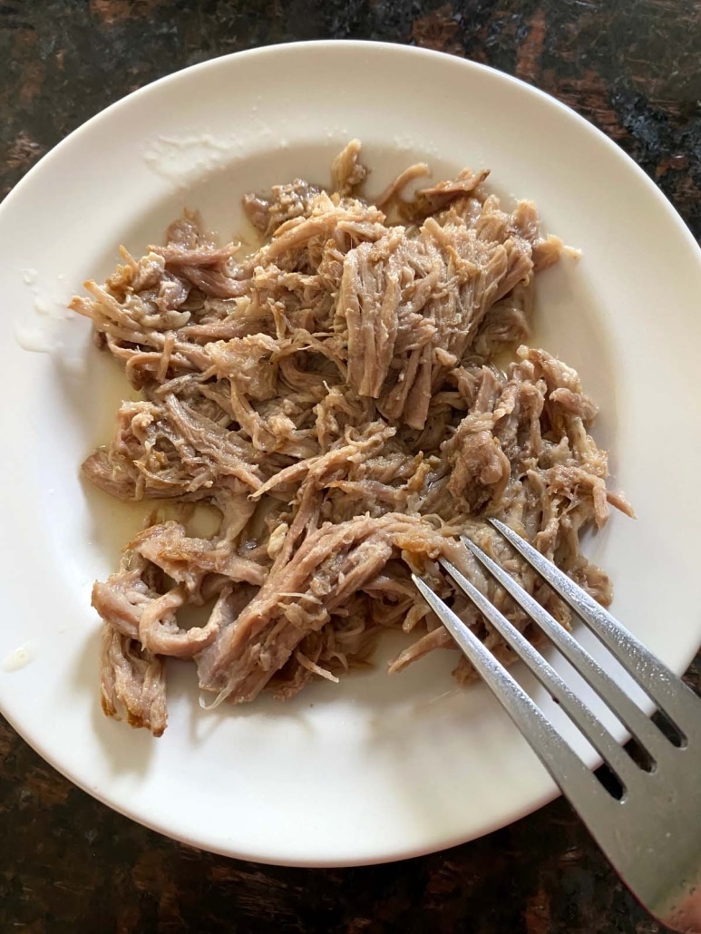 shredding Instant Pot Kalua Pulled Pork