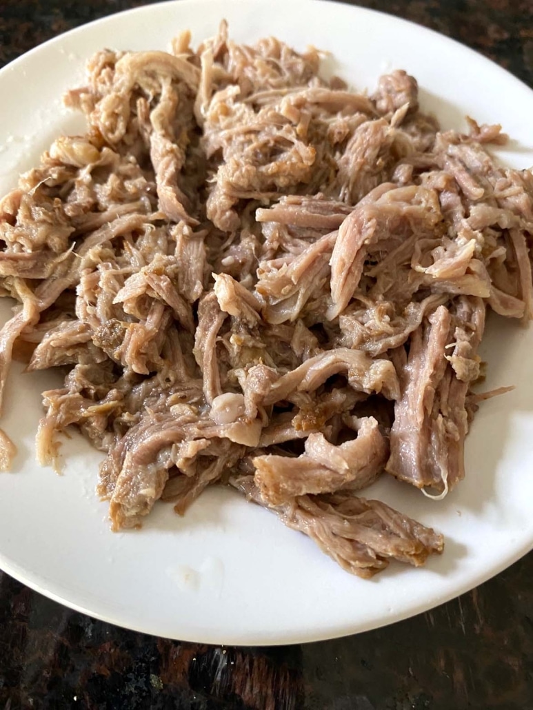 pile of tender pulled pork on plate