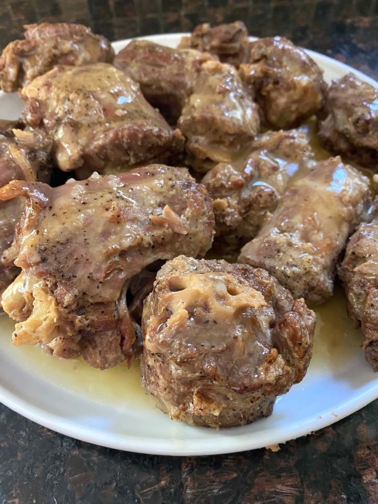 cooked turkey necks topped with gravy