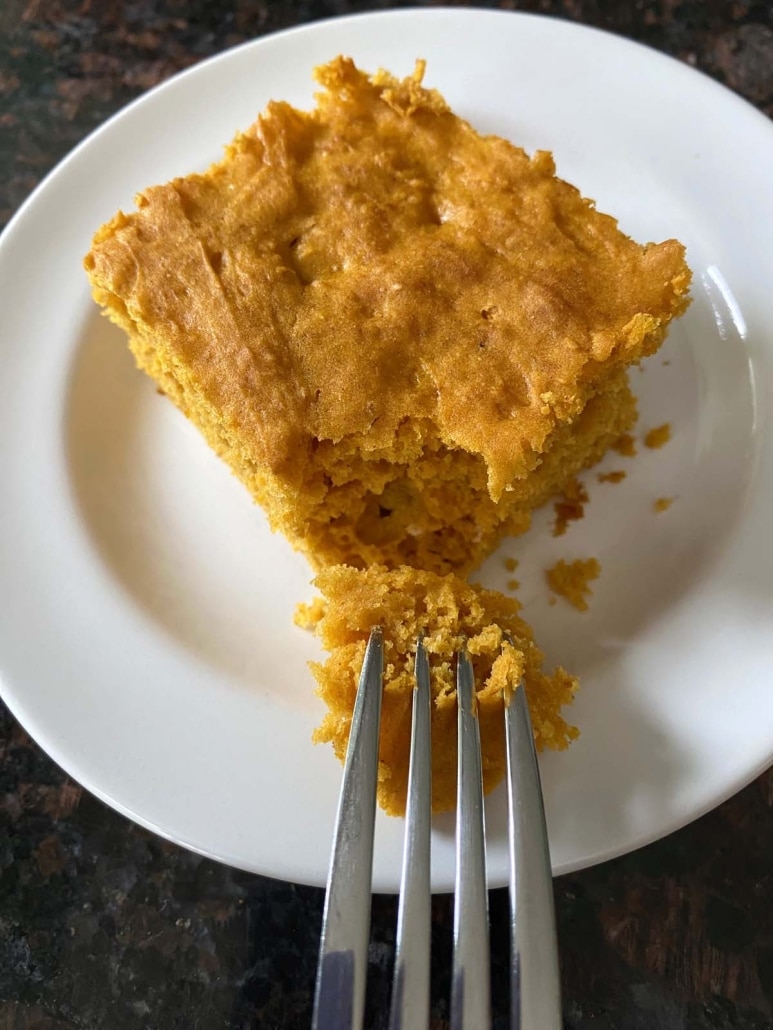 fork holding piece of pumpkin dump cake