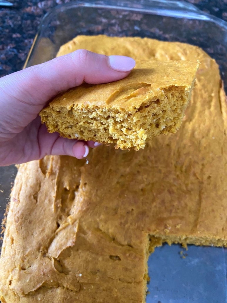 hand holding piece of easy pumpkin cake