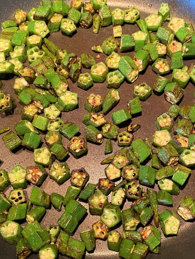 slices of okra cooking in a skillet