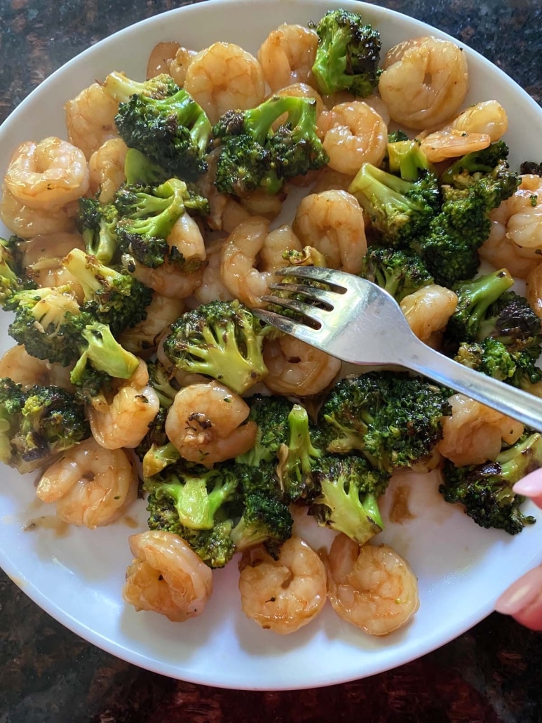 fork grabbing bite of Shrimp And Broccoli Stir Fry