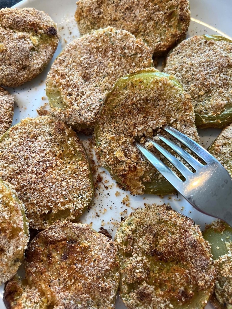 fork holding slice of Air Fryer Green Tomato