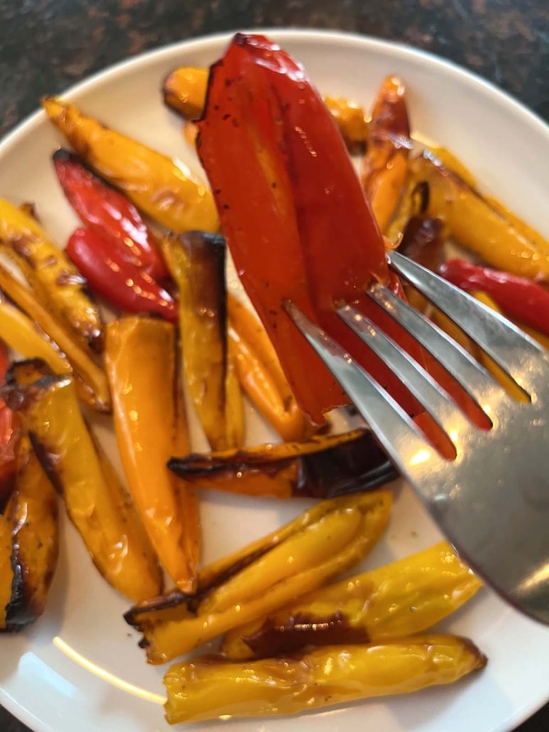 fork holding slice of Air Fryer Mini Peppers