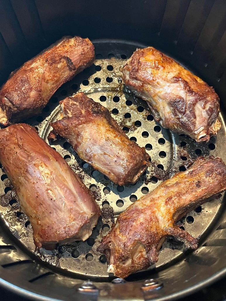 turkey necks cooking in air fryer basket