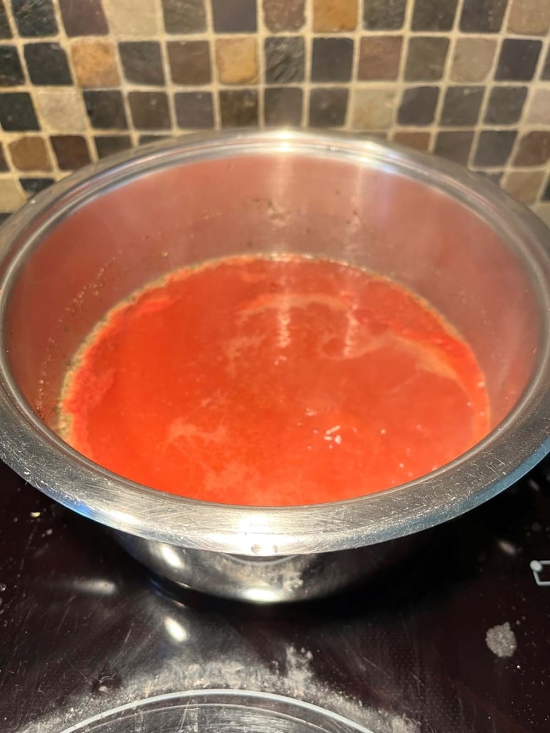 Tomato Soup With Tomato Paste simmering on the stovetop