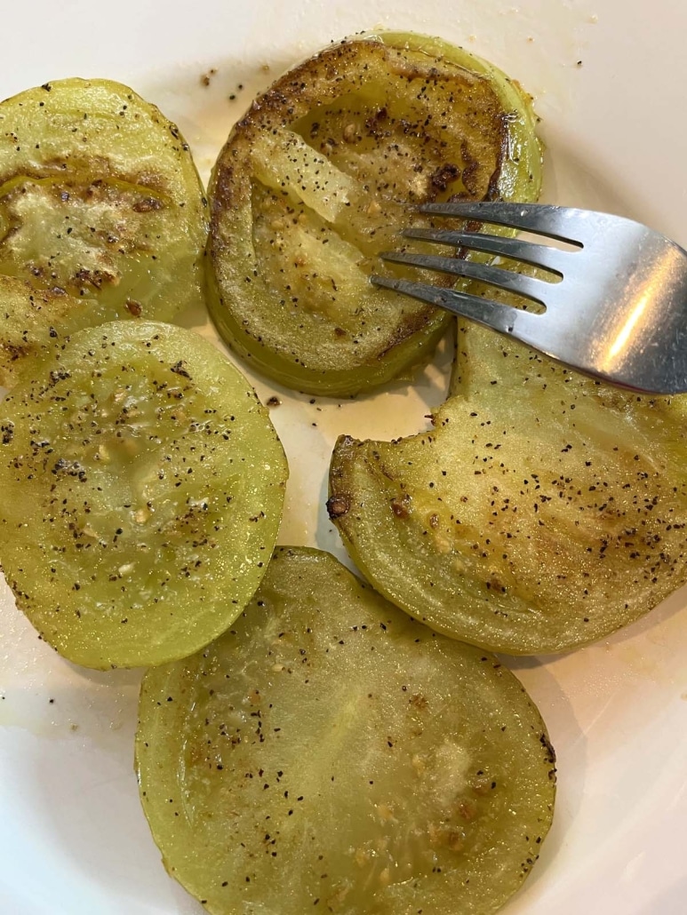 fork in slice of easy side dish Fried Green Tomatoes No Breading