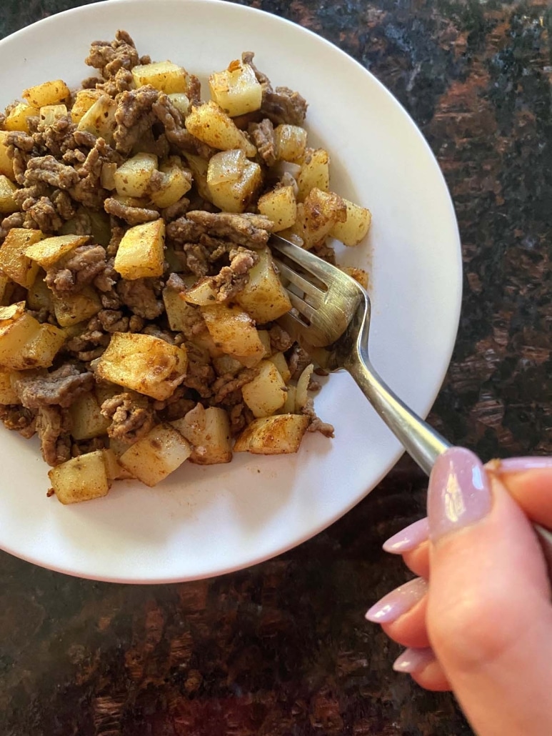 fork with bite of Ground Beef And Potatoes
