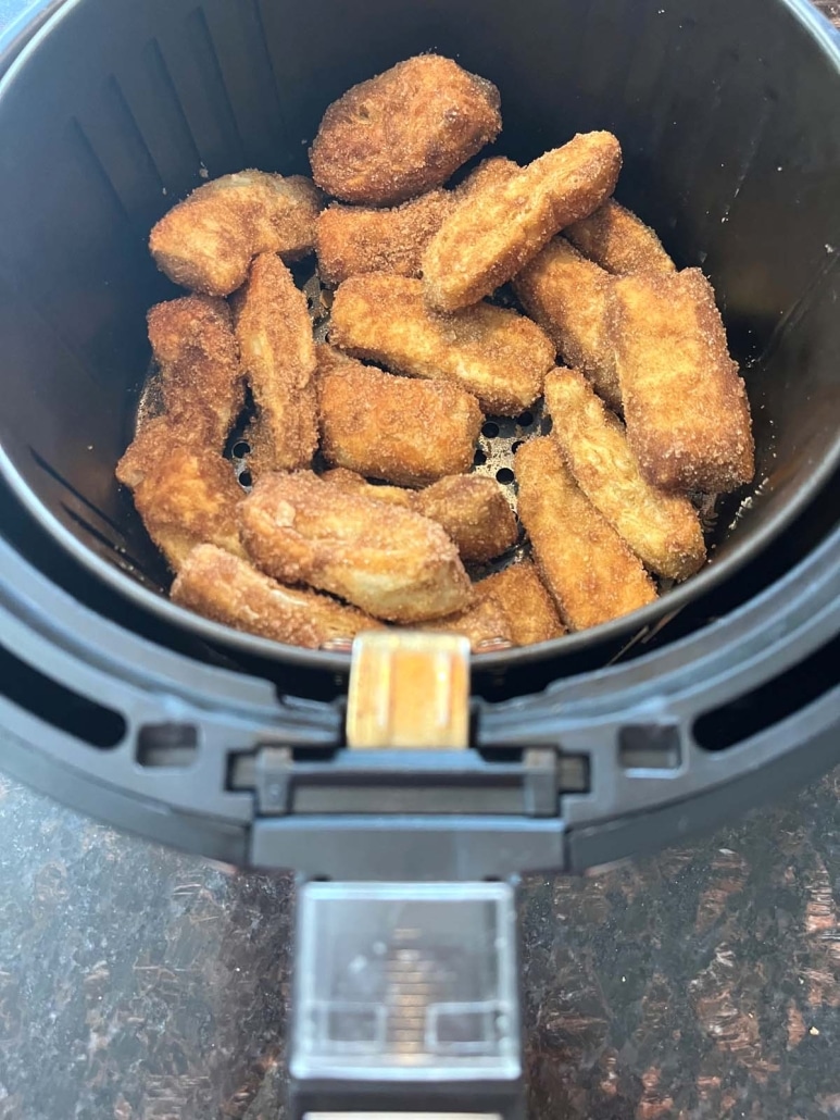 air fryer basket filled with churros made from puff pastry