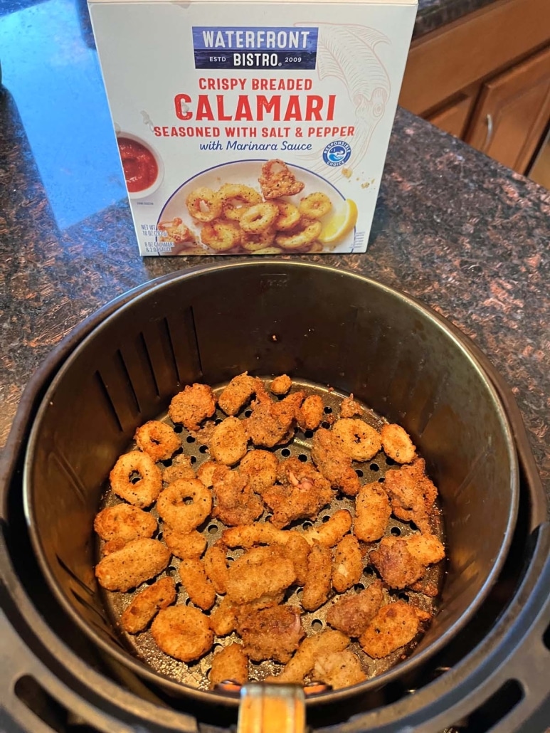 tasty air fryer calamari next to a package of frozen calamari