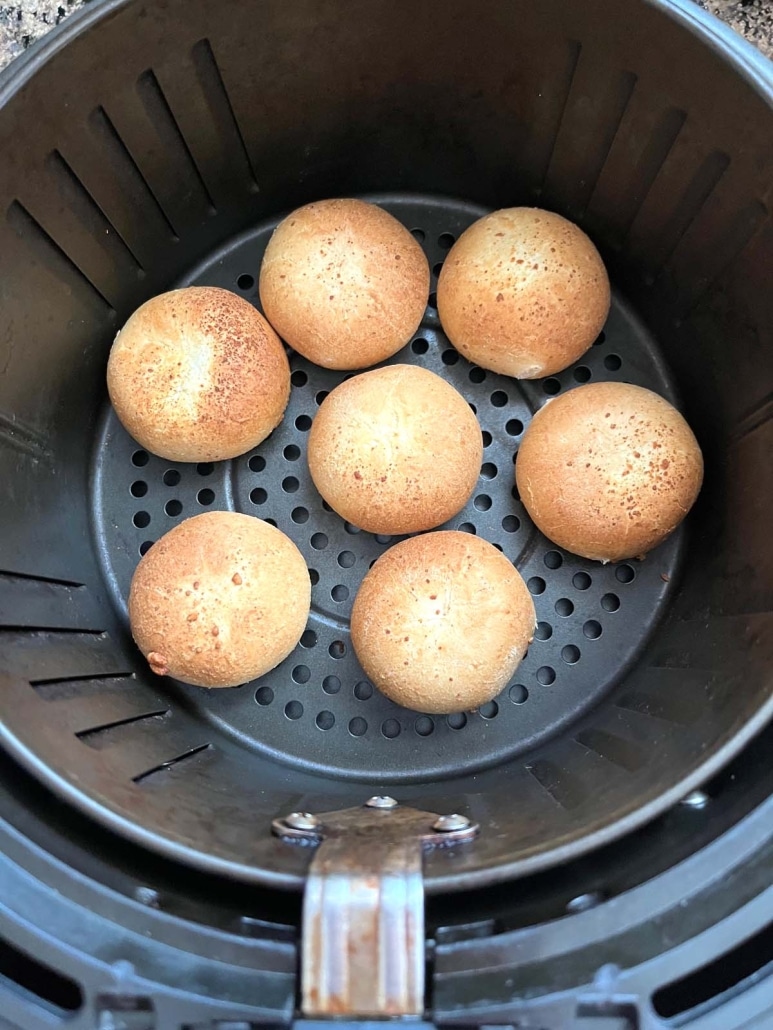 air fryer basket with mozzarella bites inside