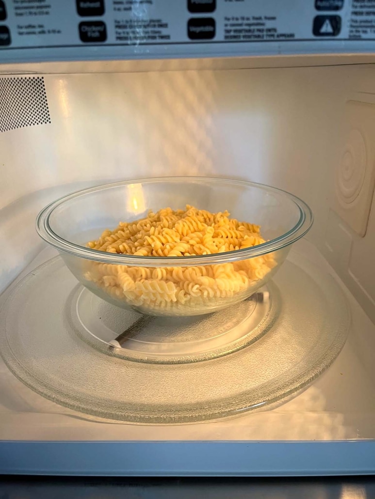 bowl of cooked pasta in the microwave