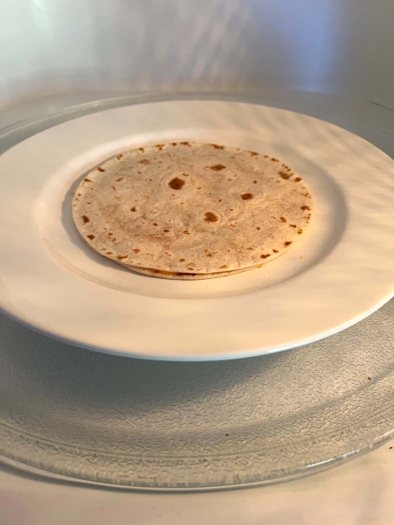 cheese quesadilla on a plate in the microwave