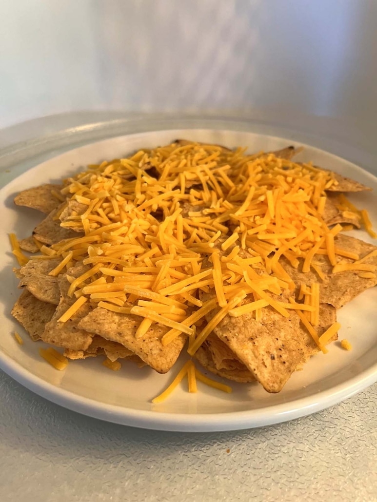 tortilla covered in shredded cheese