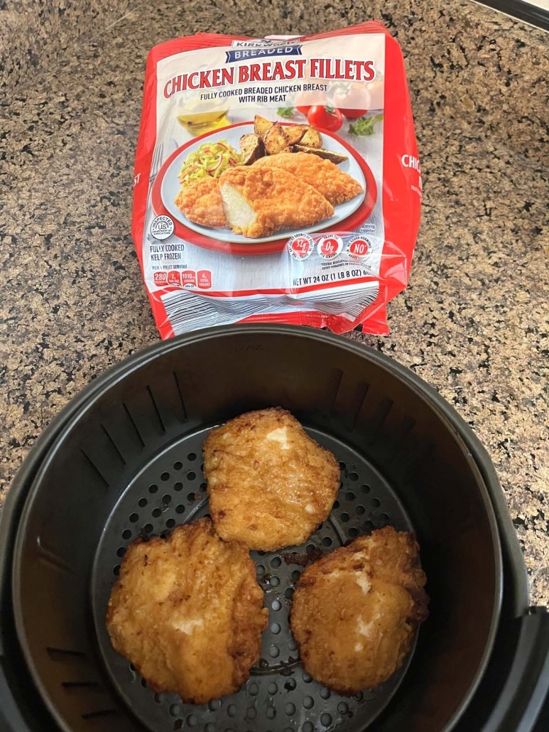 Aldi Red Bag Chicken In Air Fryer next to package of frozen chicken fillets