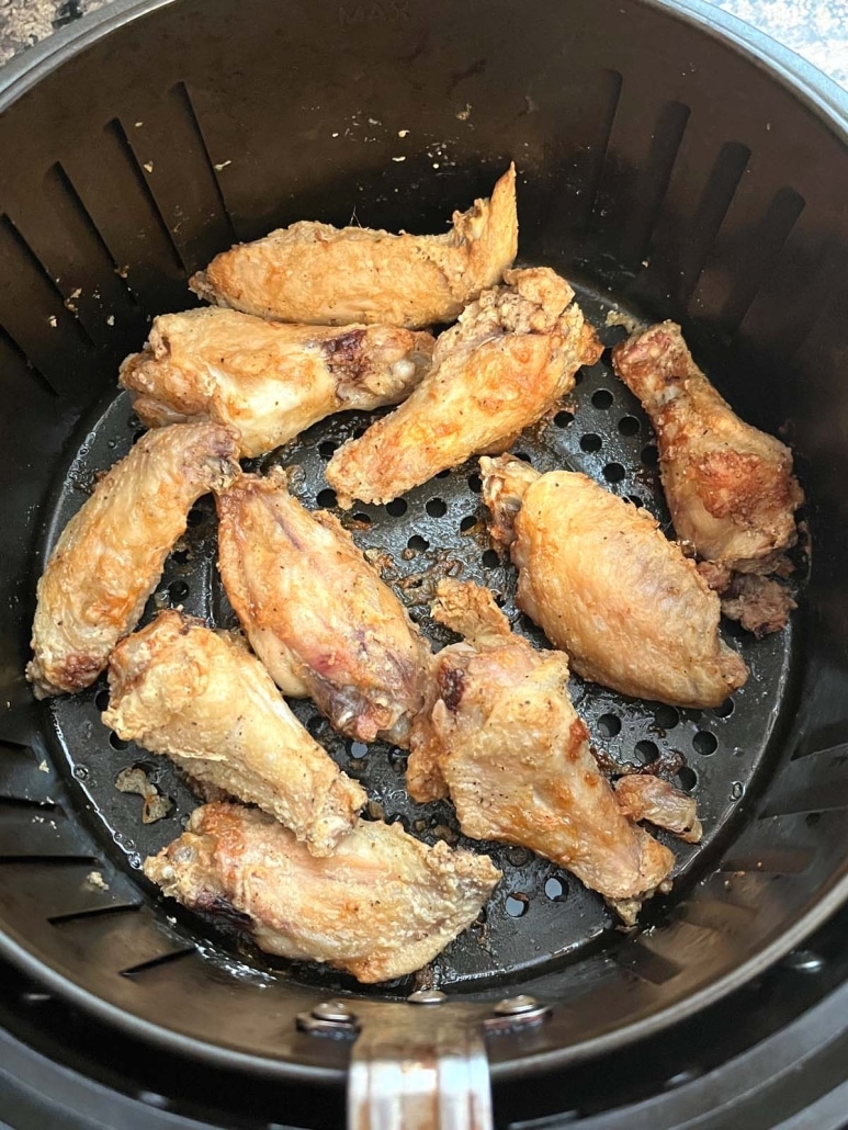 crispy chicken wings cooking in the air fryer 