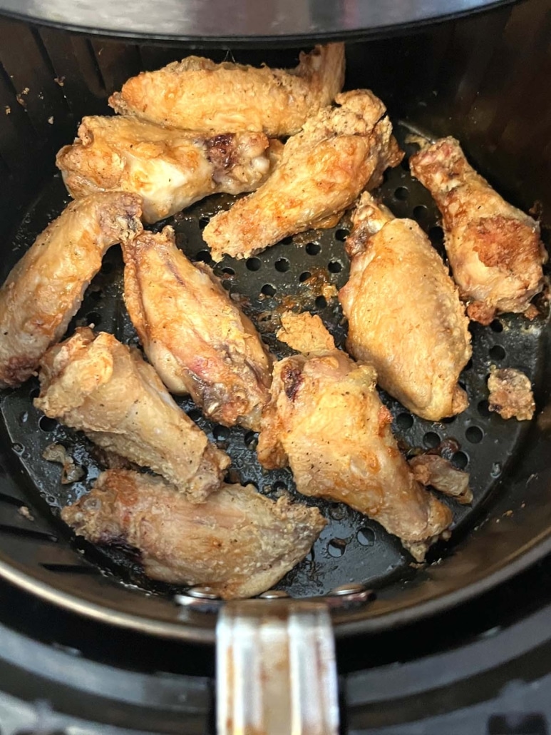 air fryer opened to show easy appetizer crispy chicken wings