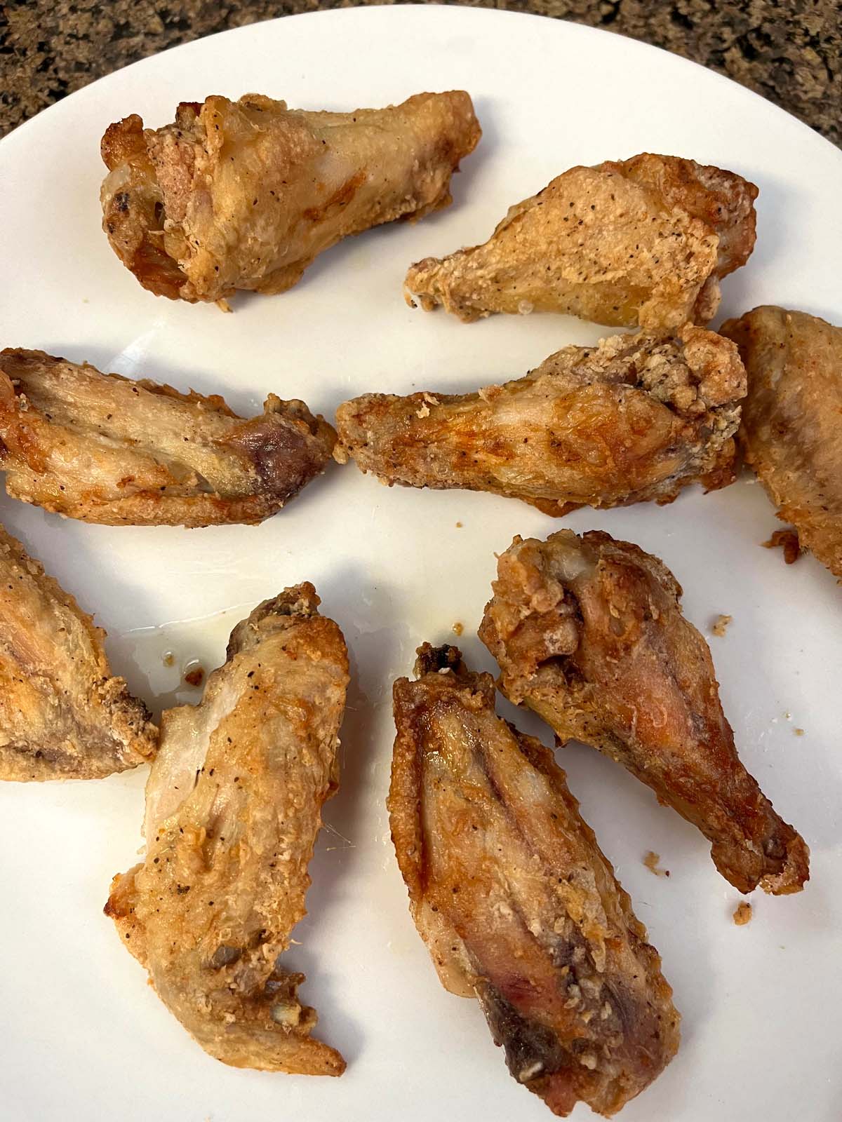 https://www.melaniecooks.com/wp-content/uploads/2023/12/Air-Fryer-Crispy-Chicken-Wings-7.jpg