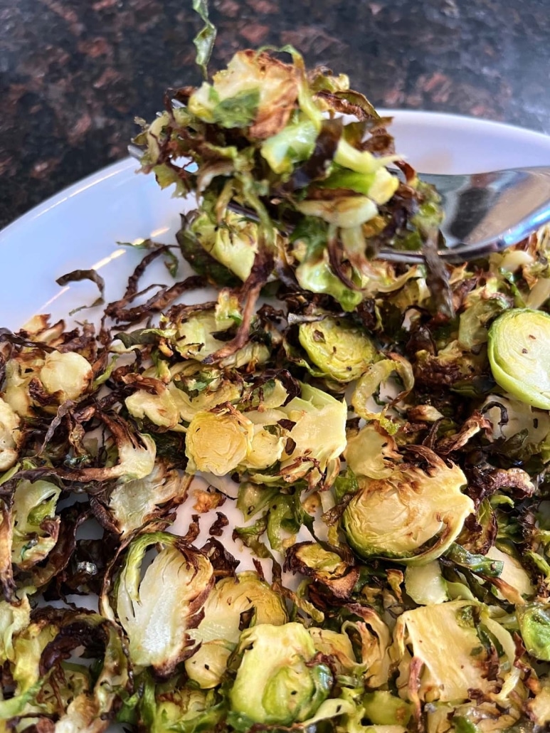 fork with bite of tasty side dish Air Fryer Shaved Brussels Sprouts