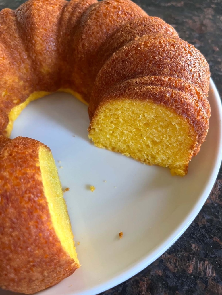 fresh lemon bundt cake with a slice cut out