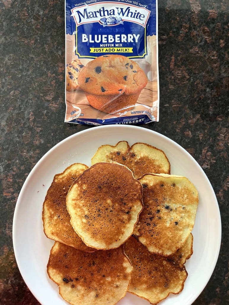 plate of Muffin Mix Pancakes next to a box of muffin mix