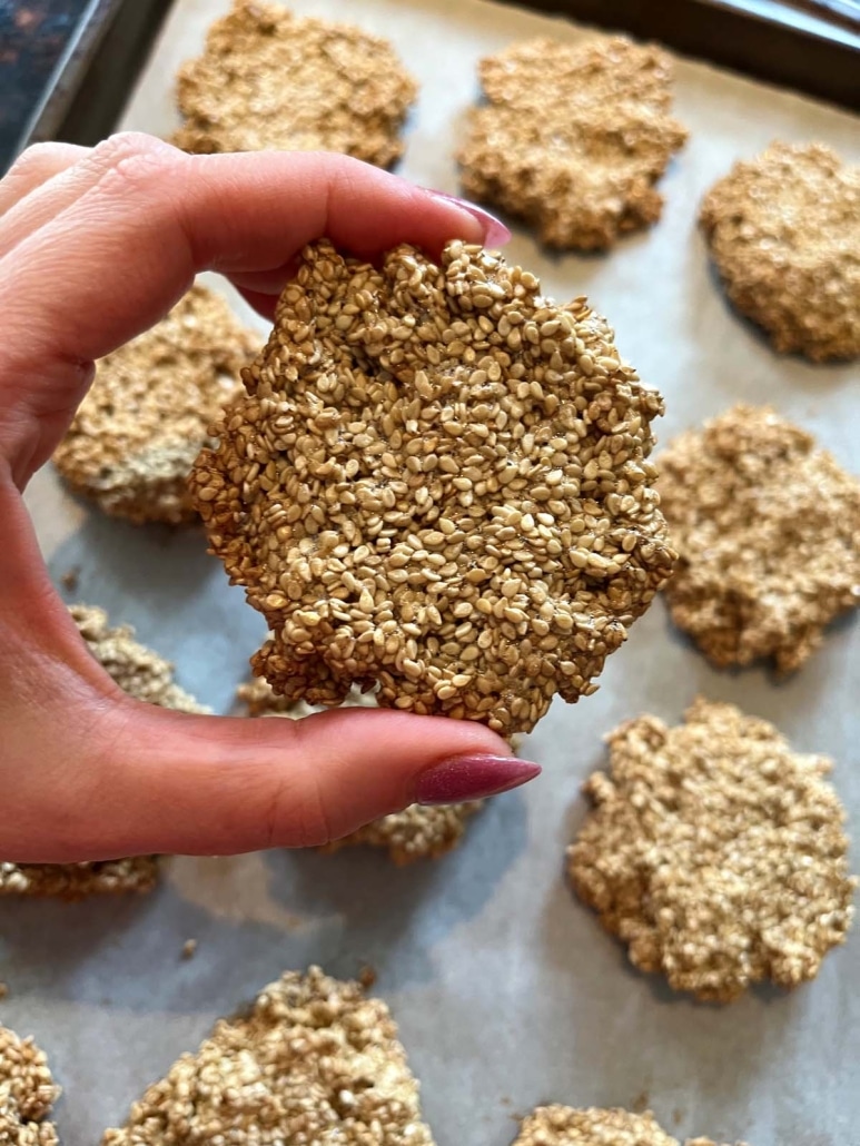 hand holding Sesame Cookie