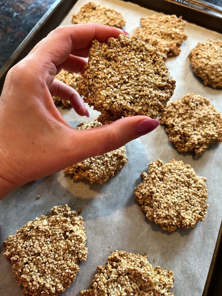 hand holding crispy and lightly sweet cookie