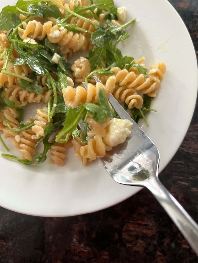 fork with bite of Arugula Pasta Salad