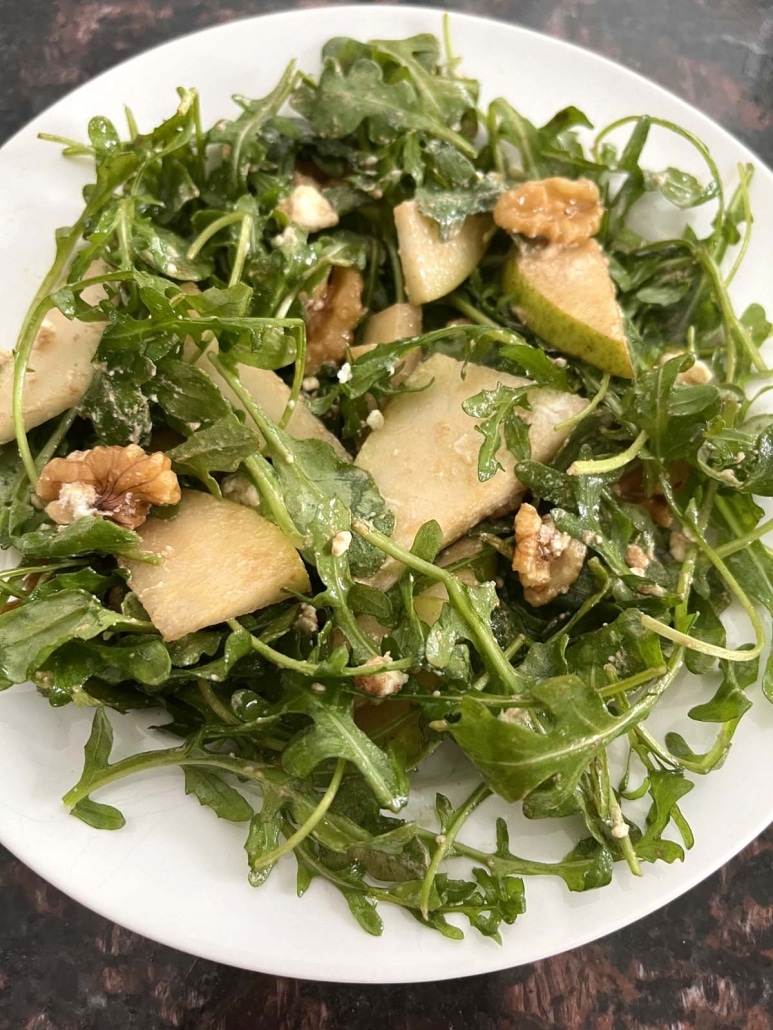 plate of Arugula Pear And Goat Cheese Salad